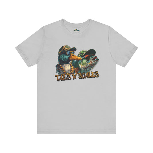 A Tails and Scales - T-Shirt with a colorful print of two ducks dressed in hip-hop style, sporting sunglasses and caps, with the words "wings 'n scales" below them, perfect as outdoor adventure apparel.