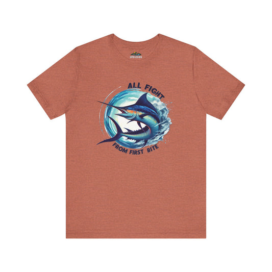 A terracotta-colored unisex Marlin All Fight from First Bite t-shirt featuring a dynamic graphic of a leaping marlin within a circular blue swirl. The text "all fight from first bite" circles the top of the design.
