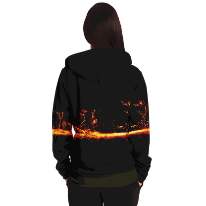 From the back, a long-haired person is seen wearing the Sonar Live Zip-Up Hoodie, which showcases a striking fiery abstract design across its back. The plain white background highlights the hoodie.