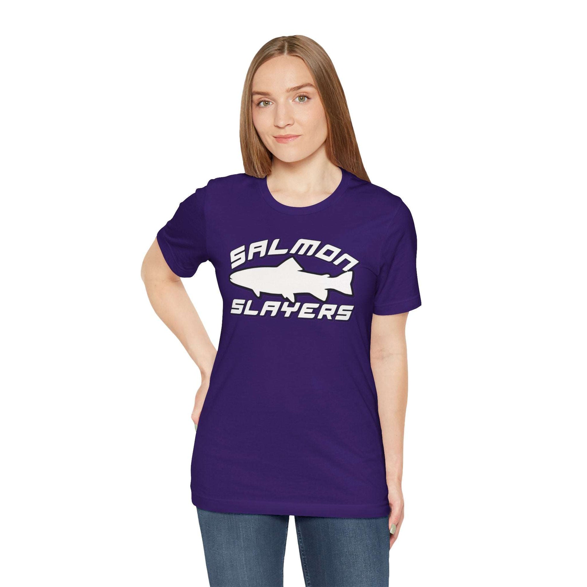 The Slamon Slayers - Sport - T-Shirt boasts a bold graphic design with a white silhouette of a fish at the center. Made from soft Airlume cotton, it features the text "Salmon Slayers" in a sporty, block-style font above and below the fish.
