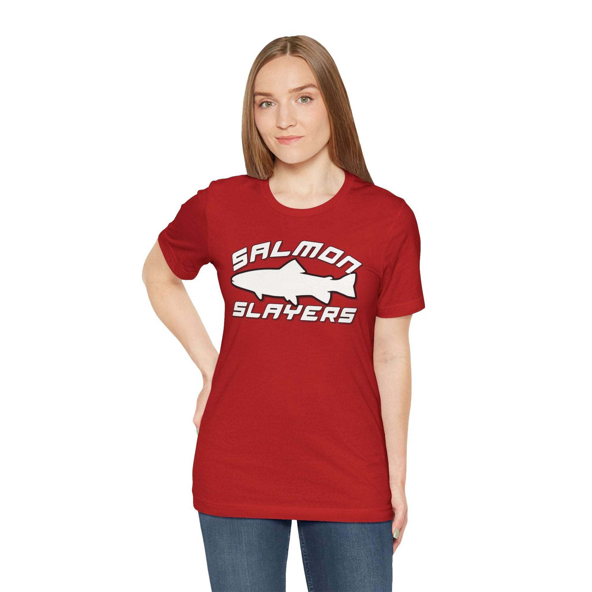 The Slamon Slayers - Sport - T-Shirt boasts a bold graphic design with a white silhouette of a fish at the center. Made from soft Airlume cotton, it features the text "Salmon Slayers" in a sporty, block-style font above and below the fish.