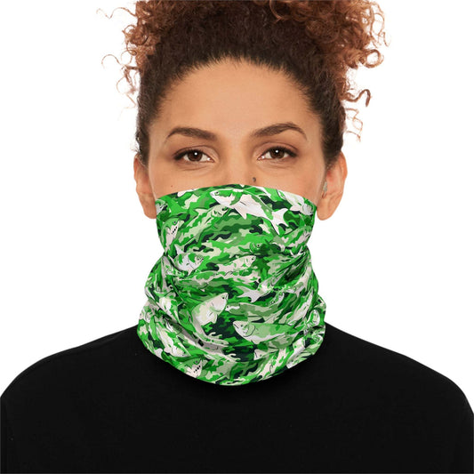 A woman with curly hair wears a Salmon Slayer - Lightweight Neck Gaiter in a fish camo pattern covering her neck and lower face. She is dressed in a black top and looks directly at the